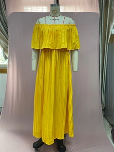 Close-up of vibrant yellow pleated chiffon maxi dress with off-shoulder ruffle neckline detail