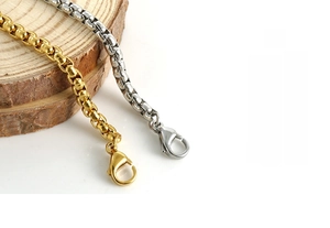 Detail of gold and silver box chains with lobster clasps made of polished stainless steel