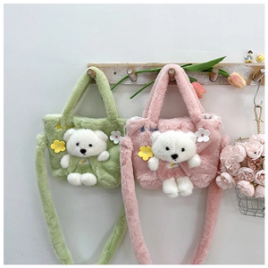 Detail of plush bear handbags in green and pink with cute 3D charms and soft fuzzy texture