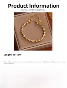 Detail of 18K gold plated titanium steel bracelet with textured silver and gold beads