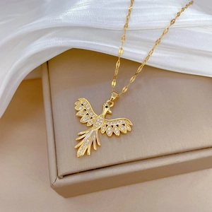 Luxury gold phoenix pendant necklace with crystals on silk background for women
