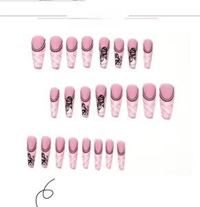 Detailed view of long coffin press-on nails with butterfly patterns and black French lines