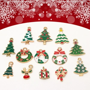 Flat lay of Christmas alloy charms including tree, reindeer and gift box for DIY jewelry