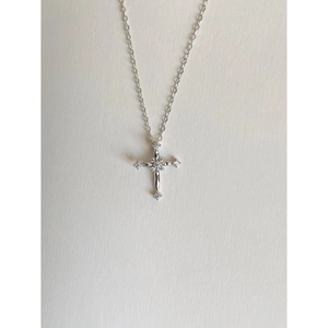 Detailed view of S925 sterling silver cross necklace with sparkling crystal inlay