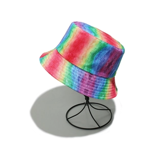 Detailed view of colorful rainbow tie-dye bucket hat with vibrant canvas texture and pattern