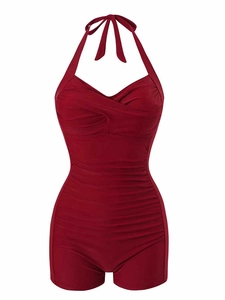 Detail of vintage burgundy halter neck swimsuit with flattering ruched stomach control