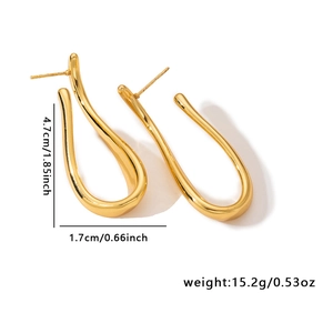 Detailed view of gold abstract teardrop earrings with dimensions 4.7cm by 1.7cm