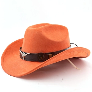 Detail of orange western cowboy hat featuring leather band and silver bull head emblem
