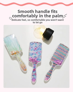 Close-up of clear hairbrushes with mermaid scales and star glitters in a macro detail