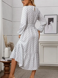 Elegant geometric print maxi dress with long puff sleeves and tiered ruffled hemline