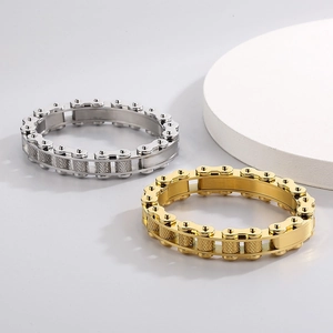 Detail of silver and gold stainless steel biker chain bracelets with knurled texture