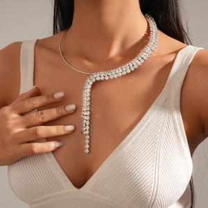 Detail view of silver tassel choker with rows of sparkling crystals on a female model