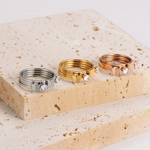 Three-piece set of butterfly rings with diamonds in silver, gold, and rose gold finish