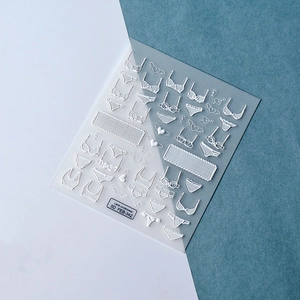 Detailed 5D embossed nail art stickers with lace lingerie patterns and heart designs