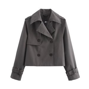 Close-up of a dark grey double-breasted short trench coat showing lapel and size S tag