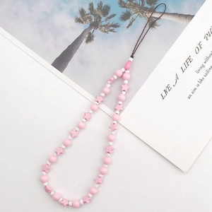 Detailed view of pink and white star-shaped beads on a DIY handmade phone lanyard chain