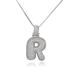 Detail of silver letter R pendant with micro-pave zircons and delicate box chain