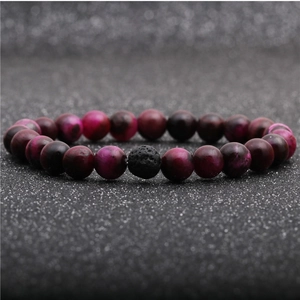 Detailed close-up of 8mm rose red tiger eye beads and black lava stone bead bracelet