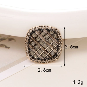 Macro detail of 2.6cm vintage bronze floral charm with rhinestones for DIY shoe decor