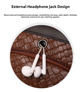 Detail of dark brown woven backpack featuring a silver headphone port and white earphones