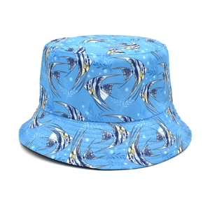 Detail of light blue bucket hat featuring tropical fish and water bubble pattern print