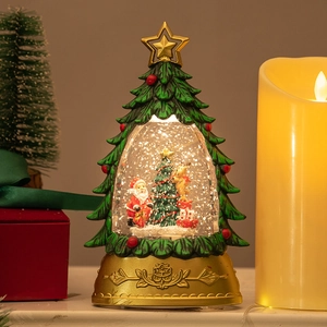 Christmas tree snow globe with Santa and LED light on an ornate gold base