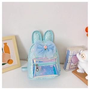 Detail of light blue girls sequin backpack with bunny ears and a large tulle bow decoration