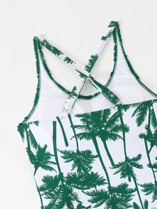 Detail of adjustable crisscross straps and palm tree print on the back of tankini top