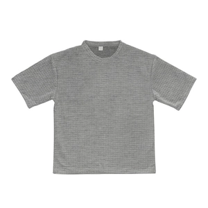Detail of gray waffle knit fabric texture on a men's short sleeve crewneck T-shirt
