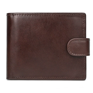 Macro view of genuine leather texture and precision stitching on dark brown wallet