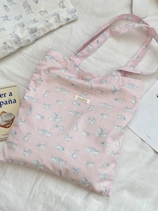 Pink canvas tote bag with blue cat print and shoulder handles for daily use