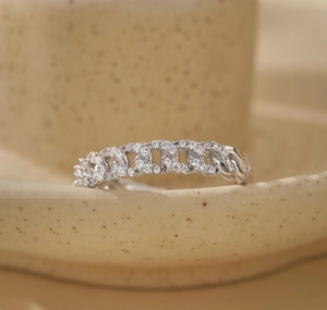 Macro view of S925 sterling silver chain ring with pavé-set shimmering zircon stones