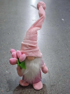 Macro shot of pink Mother's Day gnome with tulip decor and soft white beard detail