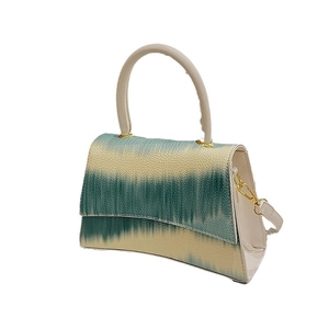 Gradient turquoise and beige crossbody bag with lychee texture and round handle