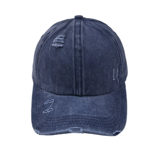 Vintage washed navy blue baseball cap with distressed details and criss-cross ponytail hole