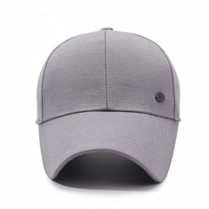 Grey baseball cap for elderly men with textured fabric and metallic badge detail