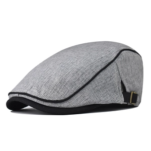 Classic cotton flat cap in grey fabric with black contrast stitching and adjustable buckle