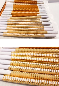 Detailed close-up of golden rectangular link chain segments with polished metallic finish