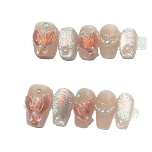 Handmade mermaid style press-on nails with 3D shell pearls and cat eye gel finish