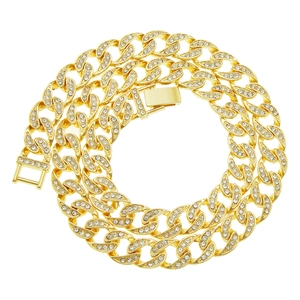 Hip hop style gold plated Cuban link necklace with iced out rhinestones on white background