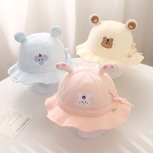 Detailed view of three baby cotton bucket hats featuring cute animal ear designs and embroidery