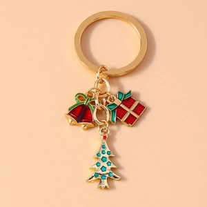 Detail of Christmas keychain with enamel bell, gift box and green tree charms
