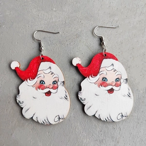 Classic Santa Claus earrings with red hat and white beard in a pair on grey background