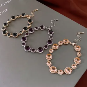 Vintage gold plated bracelets with zircon stones in grey, purple and champagne gold