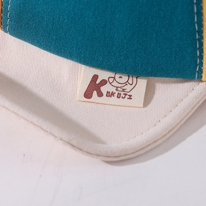 Toddler baseball cap with embroidered logo patch and contrast stitching detail