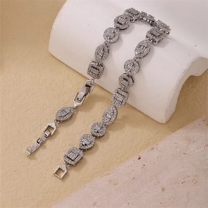Macro detail of geometric silver zircon bracelet with round and square pave links