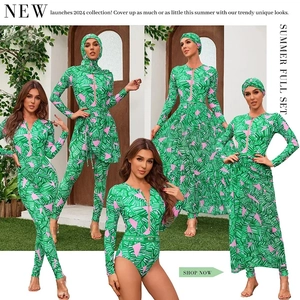 Detail of green tropical leaf print on long sleeve rash guard with zipper closure