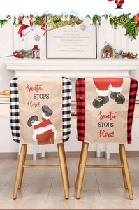 Close-up of linen Santa chimney chair covers with red and black buffalo plaid side detail