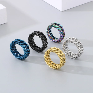 Detail showing five colors of Cuban chain rings including gold, silver, black and blue finishes