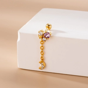 Detail of gold barbell earring with purple zircon cluster and moon pendant on chain
